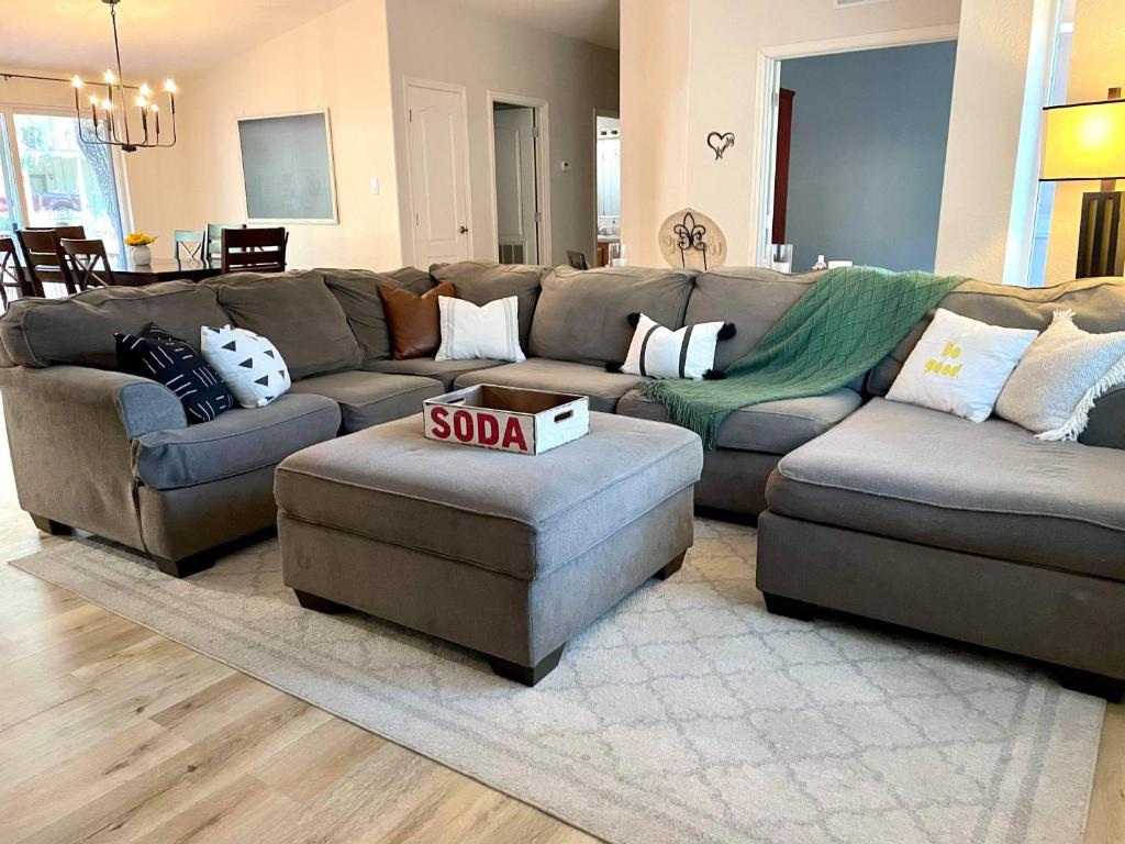 a living room with a couch and a sold sign in it at Yosemite Escapes - Pine Mountain Lake in Groveland