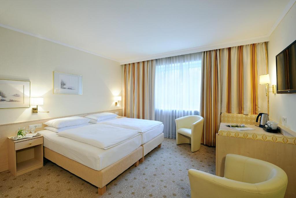 Posteľ alebo postele v izbe v ubytovaní Hotel Scherer