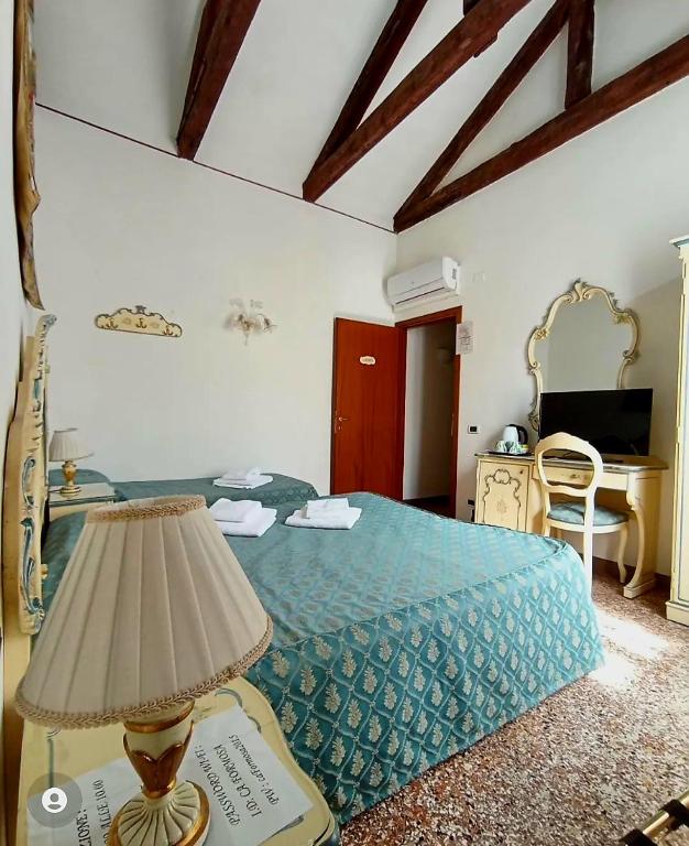 Postel nebo postele na pokoji v ubytování Locanda Ca' Formosa