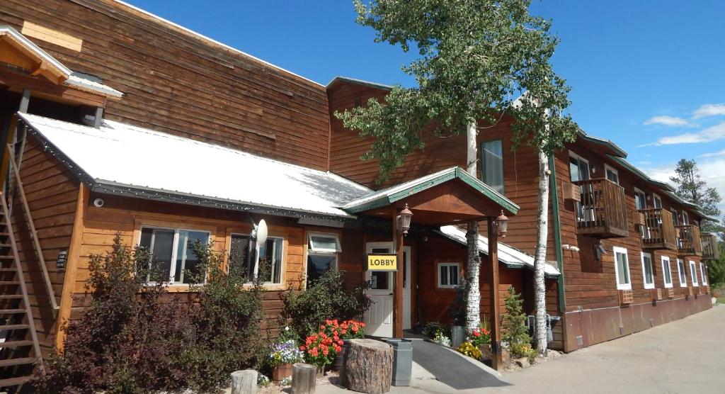 a building with a sign on the side of it at Alpine Inn in Pagosa Springs
