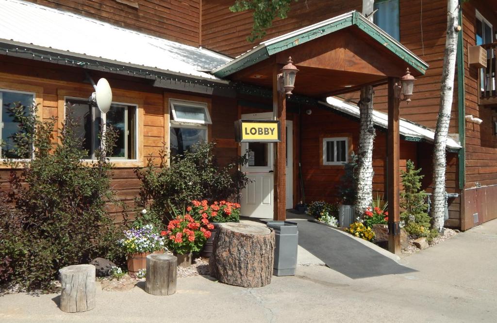 a wooden building with a sign that says hotel at Alpine Inn in Pagosa Springs