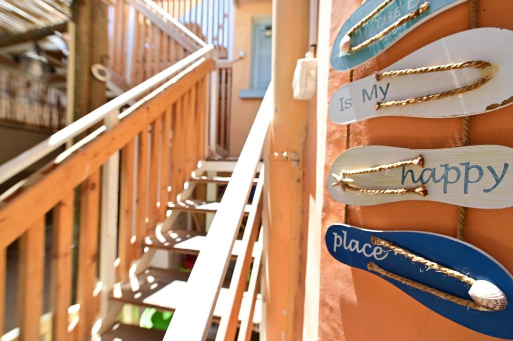 a staircase in a building with signs on the wall at Sweet Home, Only 7 Min to the beach - By SEAELO EILAT in Eilat