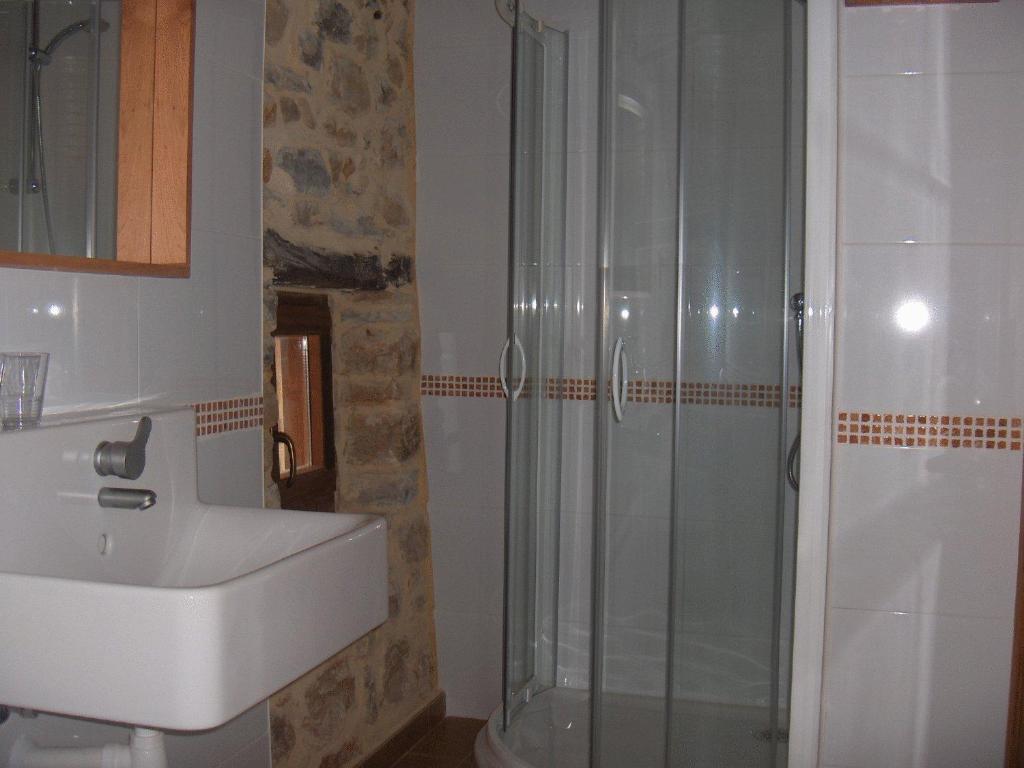 a bathroom with a sink and a shower at Apartamentos Playa Galizano in Galizano