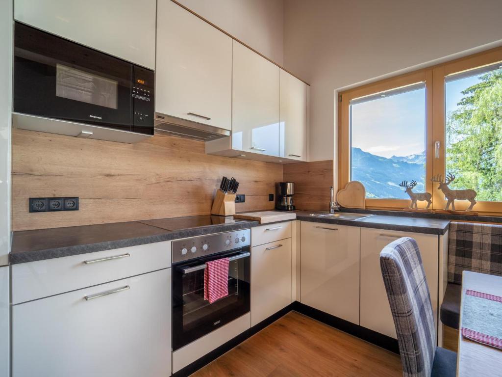 Kuchyň nebo kuchyňský kout v ubytování Chalet Georg