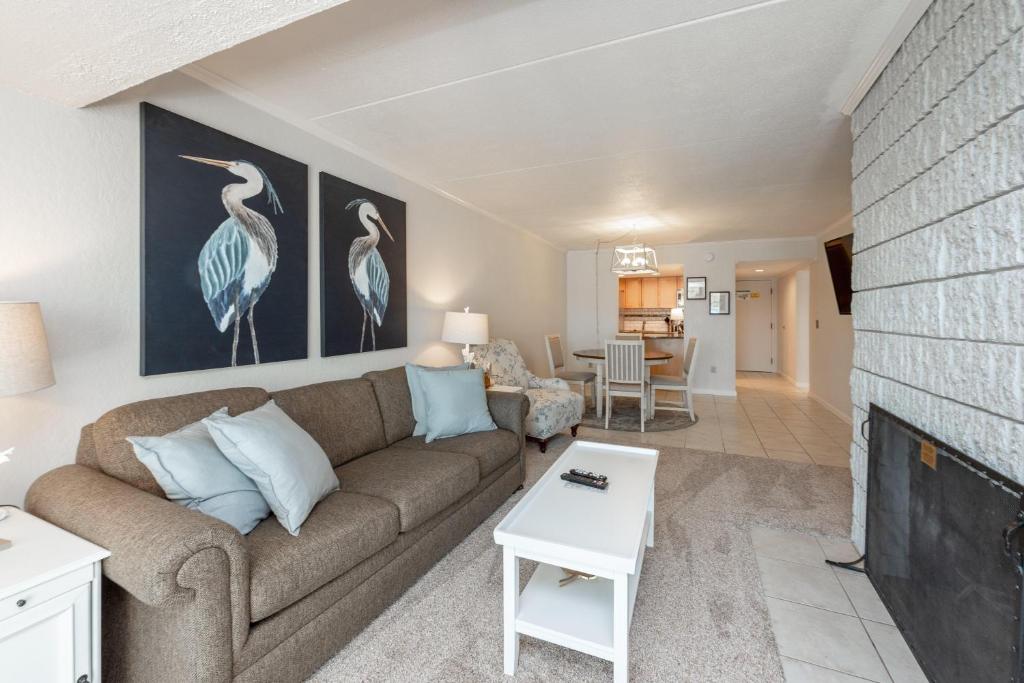 a living room with a couch and a fireplace at 207B One Bedroom One Bath in Oakland