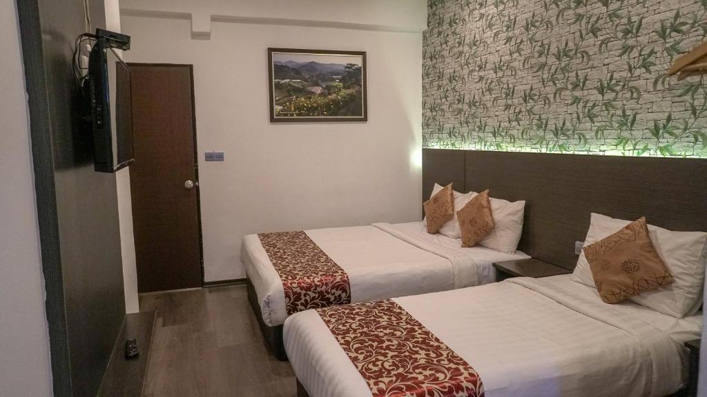 Postel nebo postele na pokoji v ubytování Highlanders Hotel