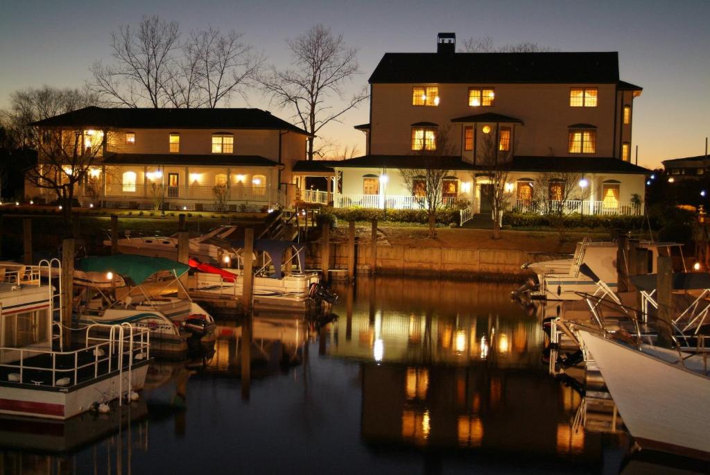 a house and boats in a marina at night at The Cypress Inn in Conway