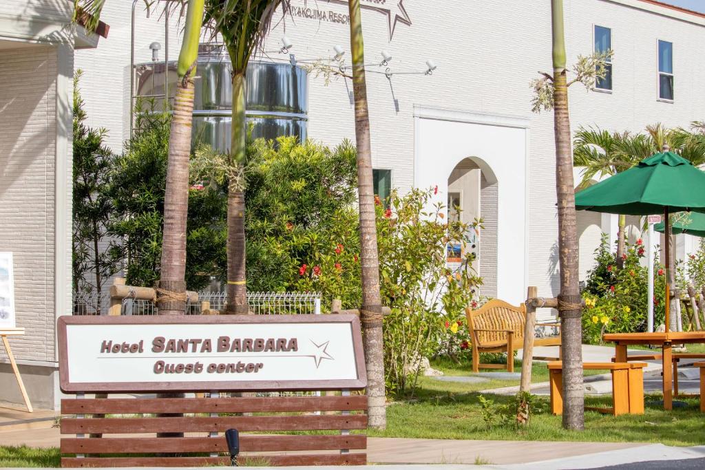 a sign for a hotel santa barbara guest courtyard at Hotel Santa Barbara Miyakojima Resort in Miyako-jima