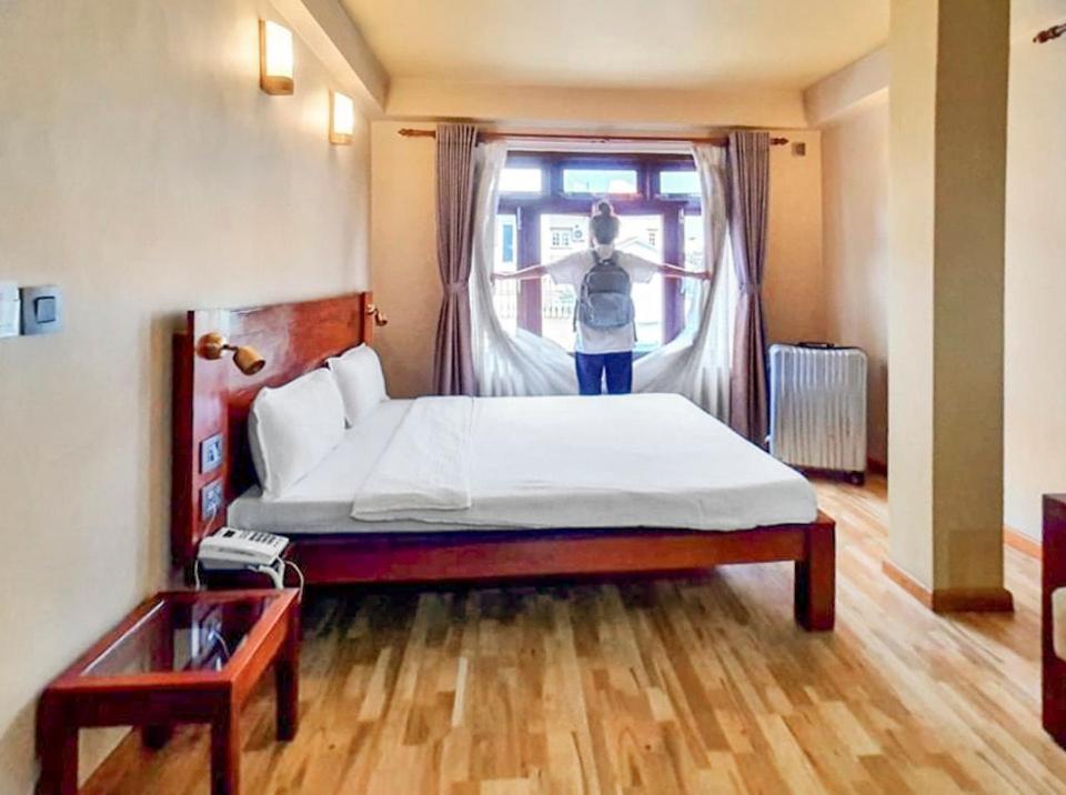Een bed of bedden in een kamer bij Sabila Boutique Hotel