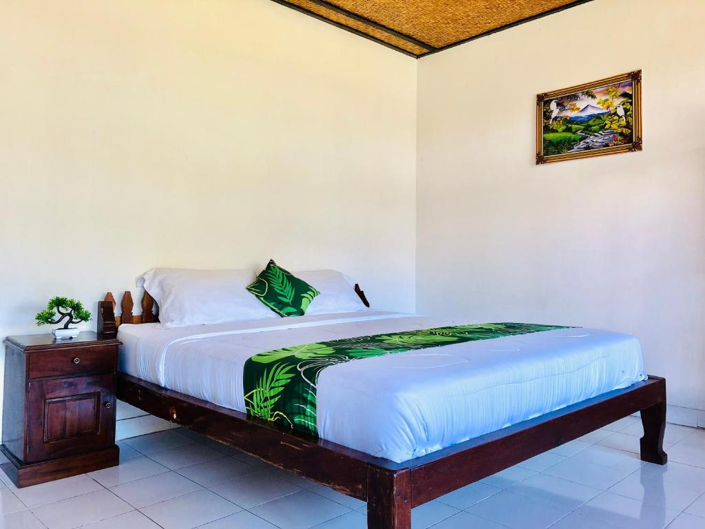 Ένα ή περισσότερα κρεβάτια σε δωμάτιο στο Ampik Batur