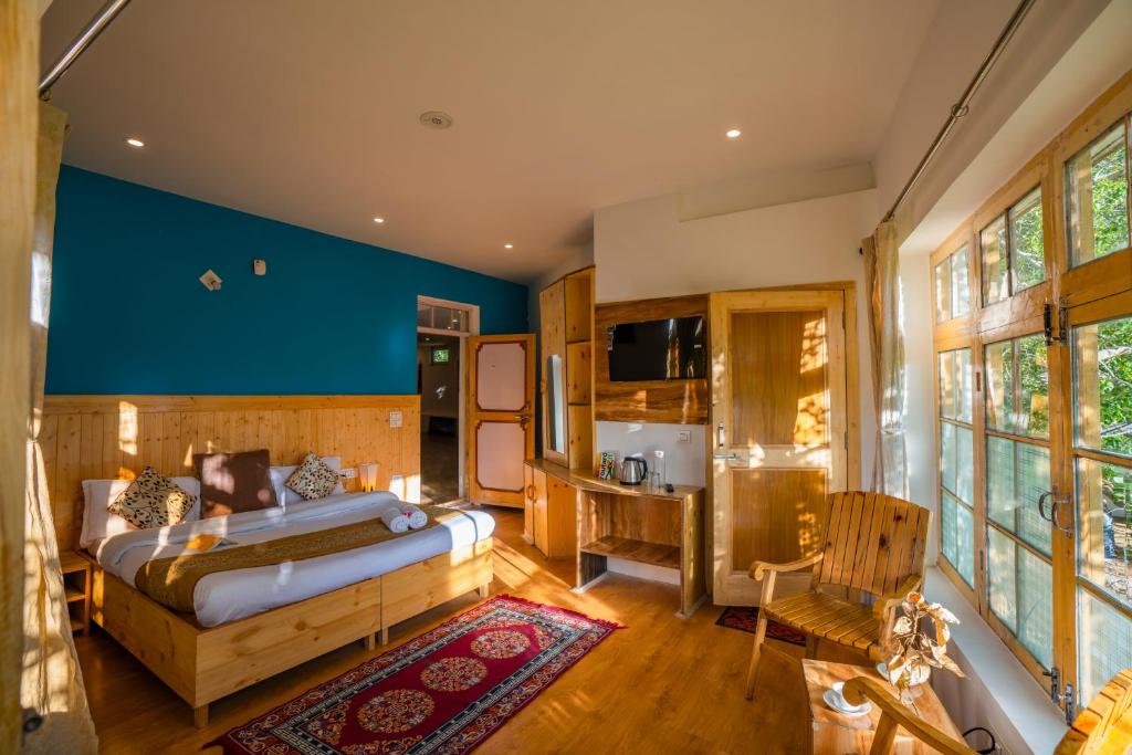 Postel nebo postele na pokoji v ubytování Rainbow Hostelier
