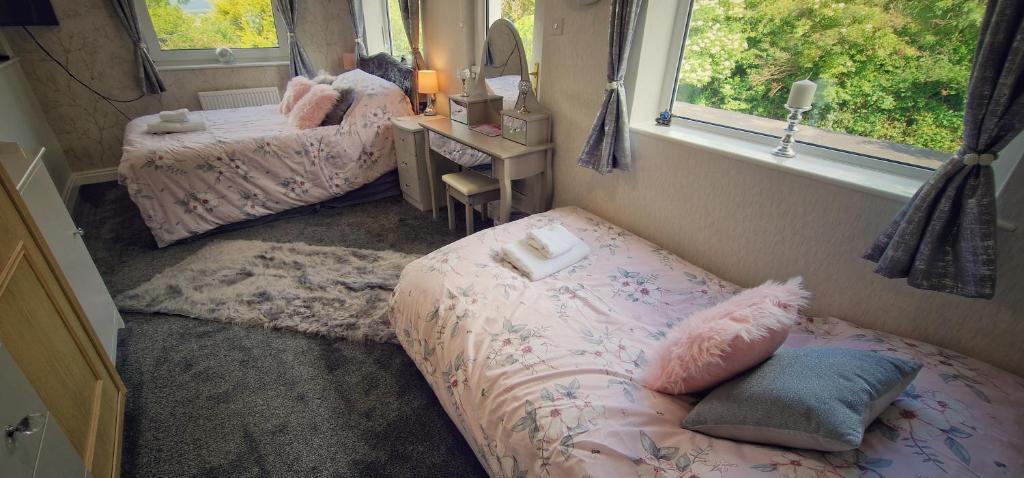 Postel nebo postele na pokoji v ubytování Alma Cliffe Guest House