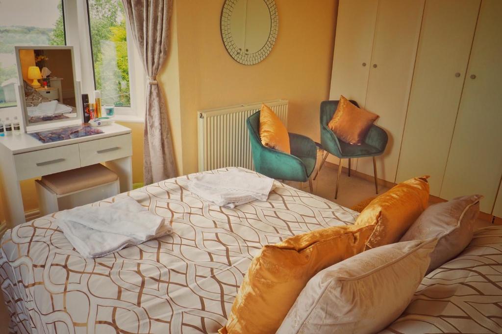 Postel nebo postele na pokoji v ubytování Alma Cliffe Guest House