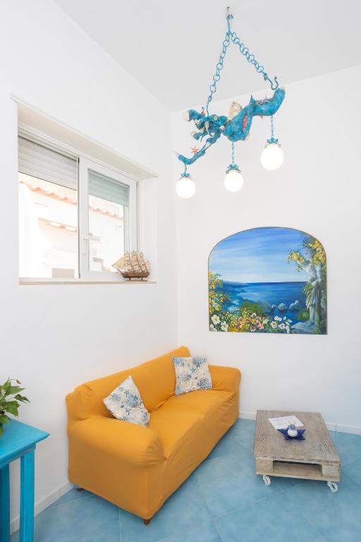a living room with a couch and a table at La Bella Annacapri in Anacapri