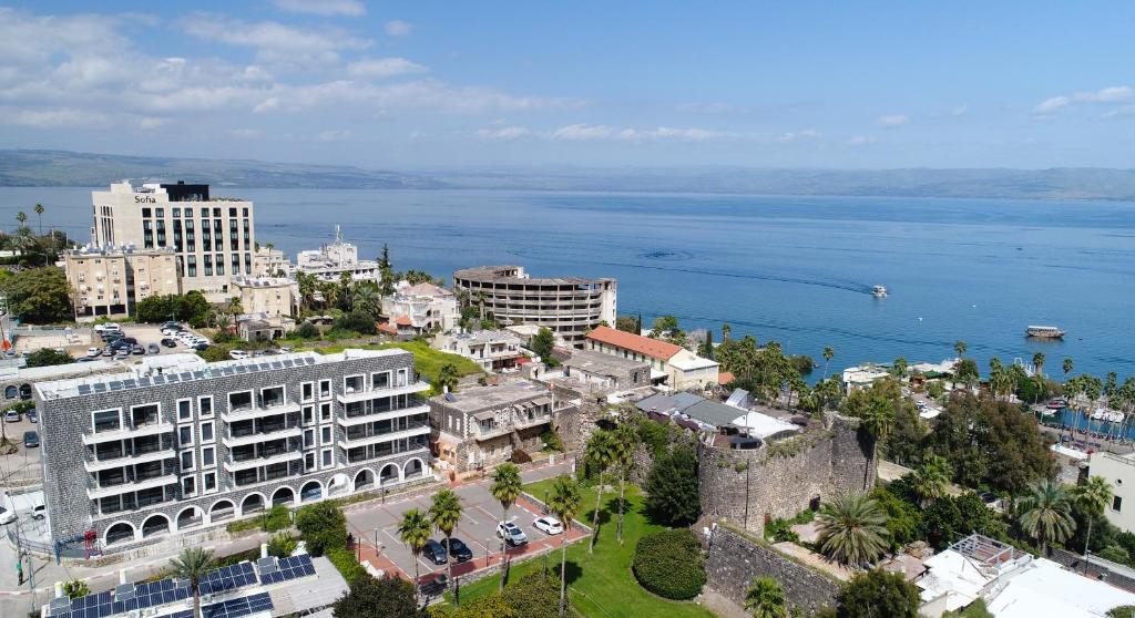 an aerial view of a city and the ocean at אצולת הים - טבריה in Tiberias