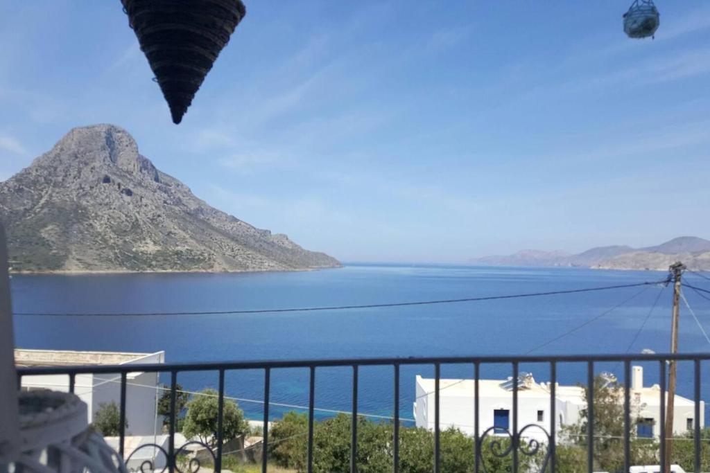 a view of the ocean from a balcony at Grande Grotta Studios - Sleeps 8 - Free Parking in Masouri