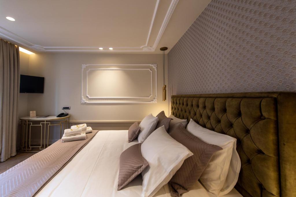 Postel nebo postele na pokoji v ubytování Capolavoro Suites