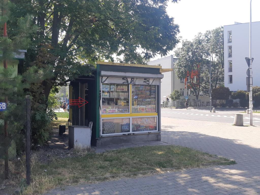 a bus stop on the side of a street at Eloft Saska Kępa in Warsaw