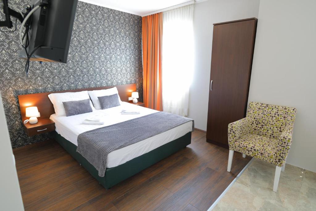 Postel nebo postele na pokoji v ubytování Fenix Apartments