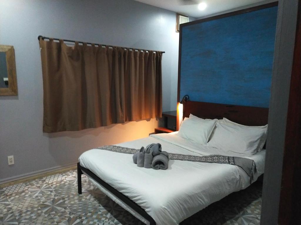 Postel nebo postele na pokoji v ubytování Zen Résidence Laos #5 to #8
