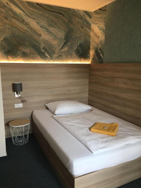 Postel nebo postele na pokoji v ubytování Hotel Trim