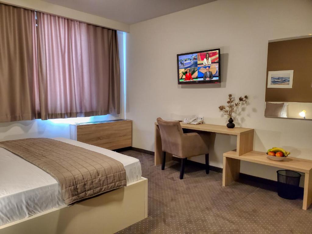 Postel nebo postele na pokoji v ubytování Hotel Argentum
