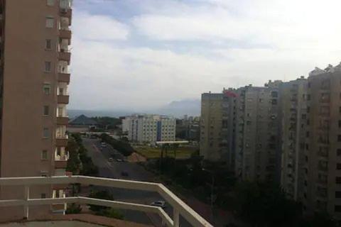 a view of a city street with tall buildings at LUXURY FLAT WITH A SEAVIEW — 800M TO BEACH PARK, 1KM TO MALL in Antalya