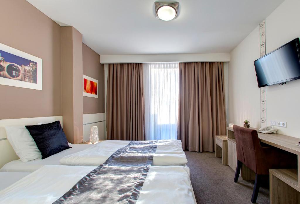 TV a/nebo společenská místnost v ubytování Hotel Argentum