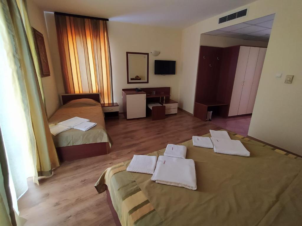 Postel nebo postele na pokoji v ubytování Hotel Veris