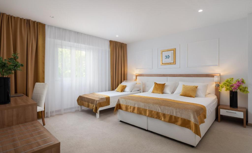Krevet ili kreveti u jedinici u objektu Hotel Corner