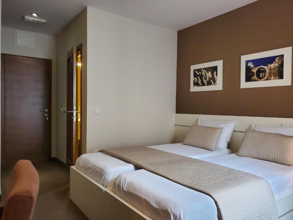 Postel nebo postele na pokoji v ubytování Hotel Argentum