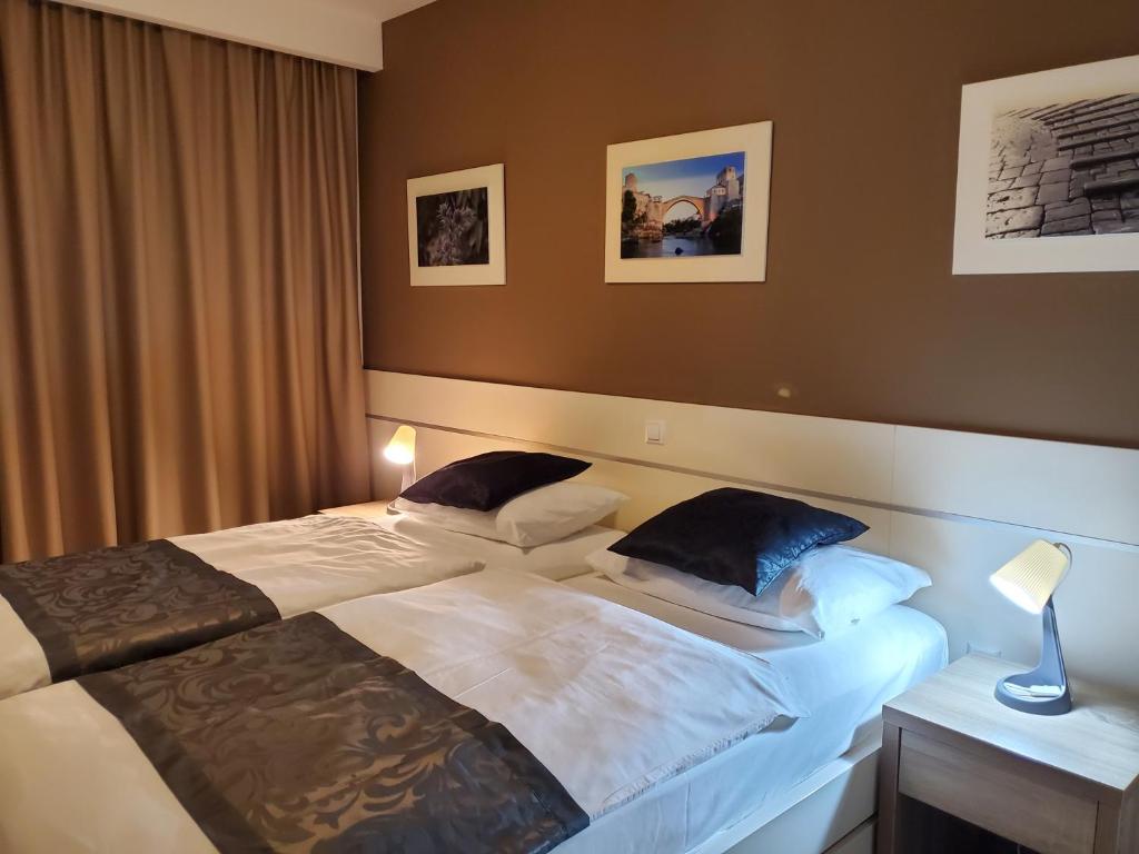 Postel nebo postele na pokoji v ubytování Hotel Argentum