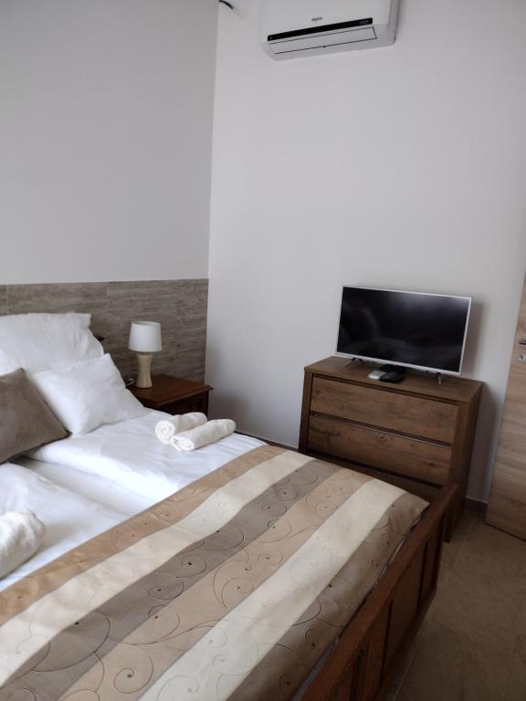 Postel nebo postele na pokoji v ubytování Tandem apartman