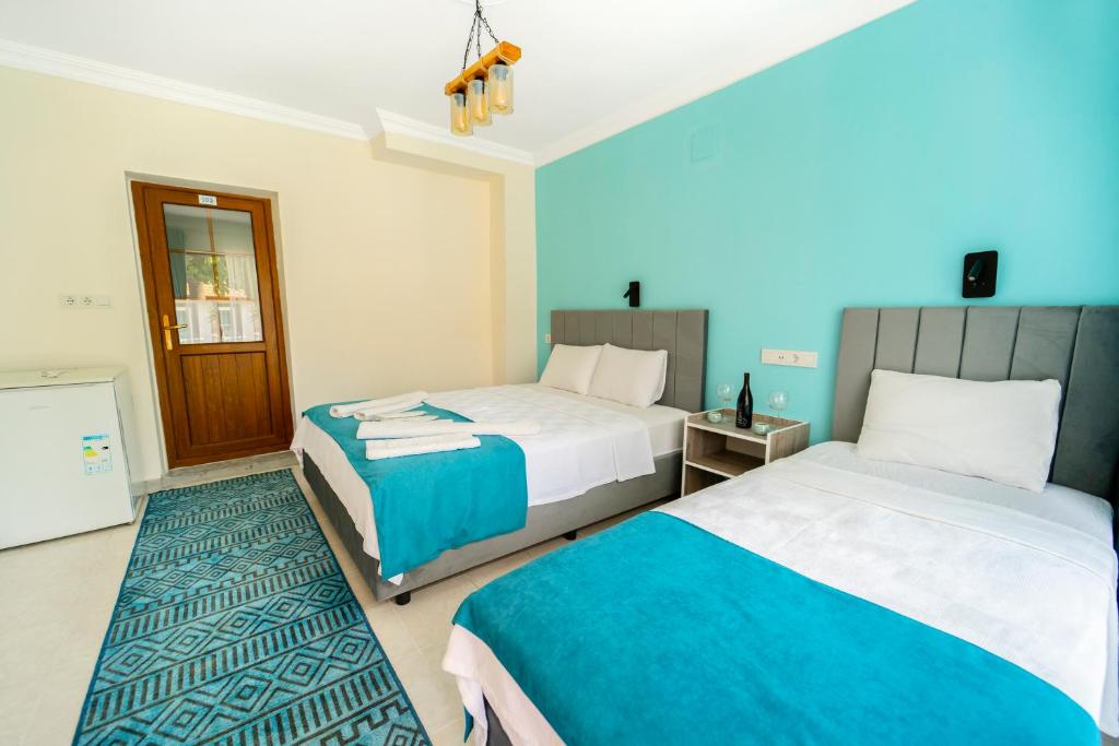 Кровать или кровати в номере Flower Hotel Patara