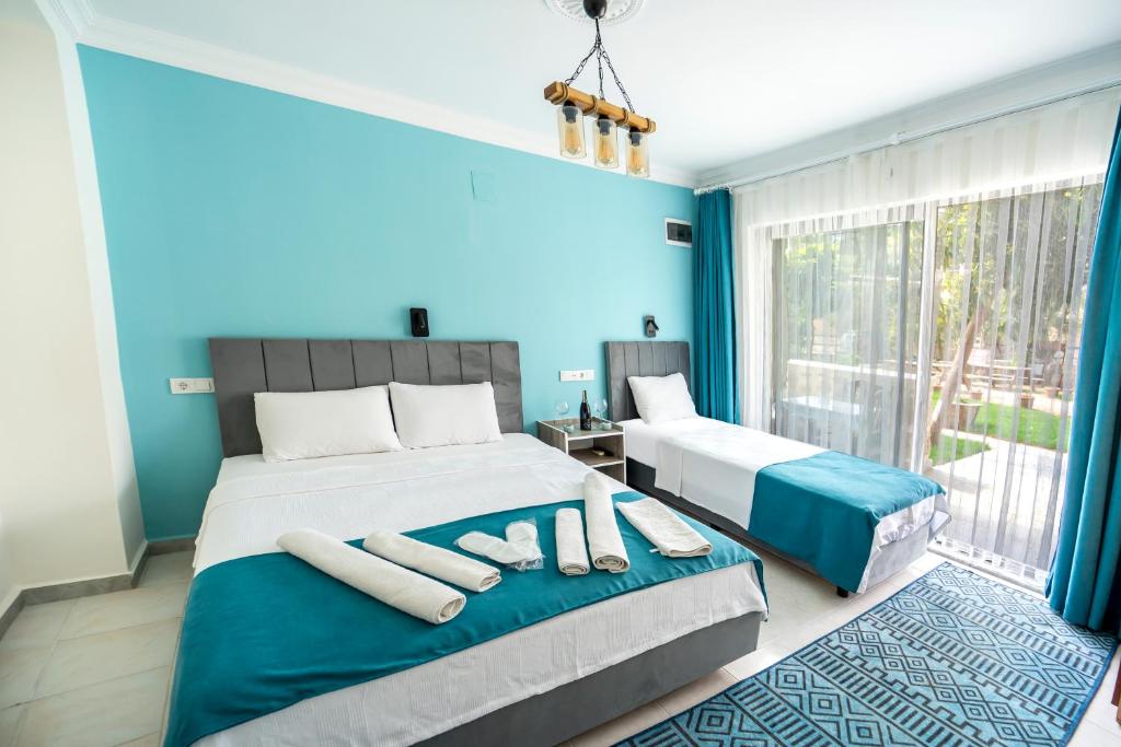Кровать или кровати в номере Flower Hotel Patara