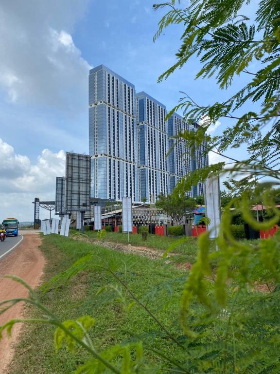 a view of a city skyline with tall buildings at Galeno Pollux Habibie in Batam Center