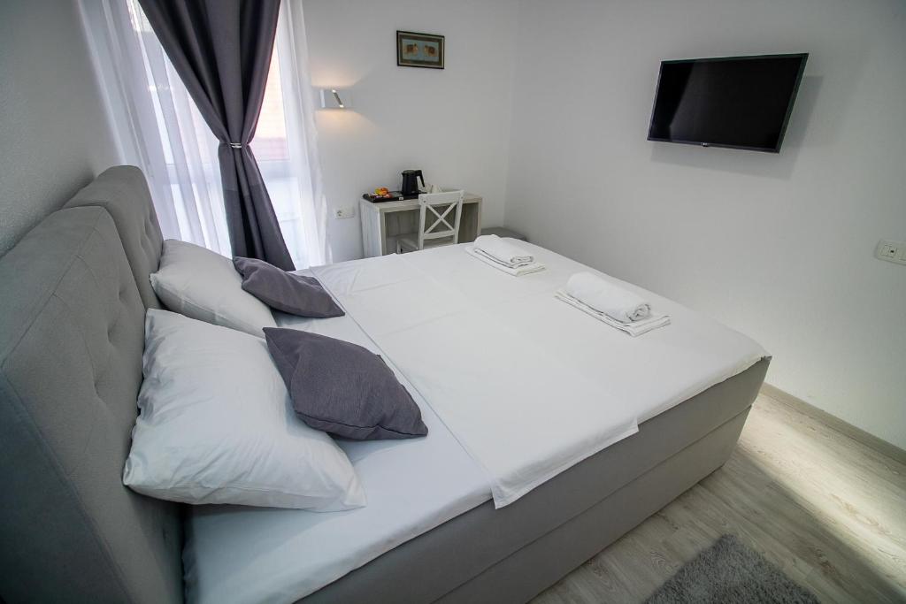 Postel nebo postele na pokoji v ubytování Villa Sonata