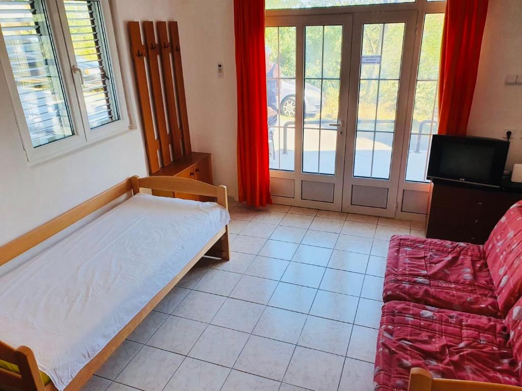 Postel nebo postele na pokoji v ubytování Colic apartments