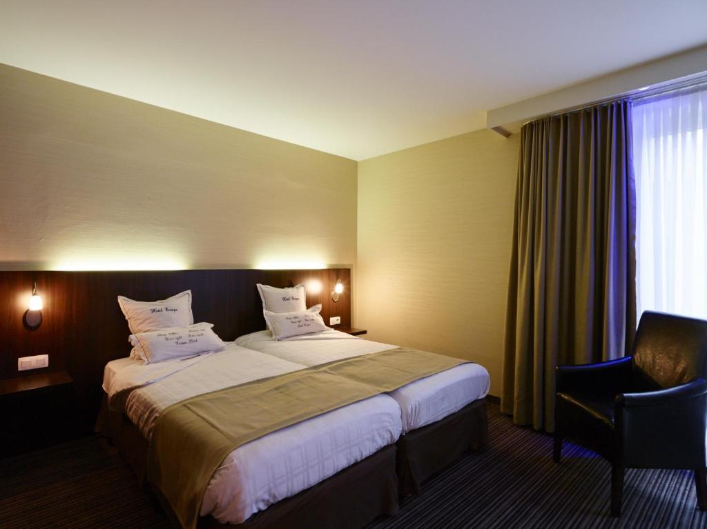 Postel nebo postele na pokoji v ubytování Hotel Europe