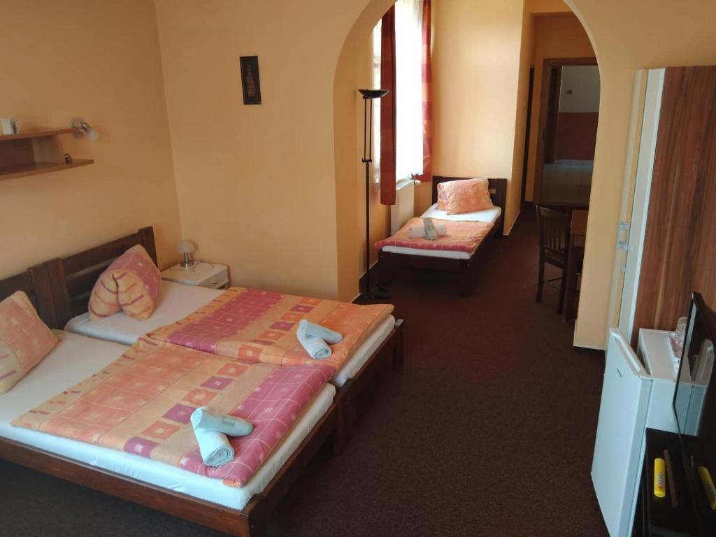 Postel nebo postele na pokoji v ubytování Hotel Jaro