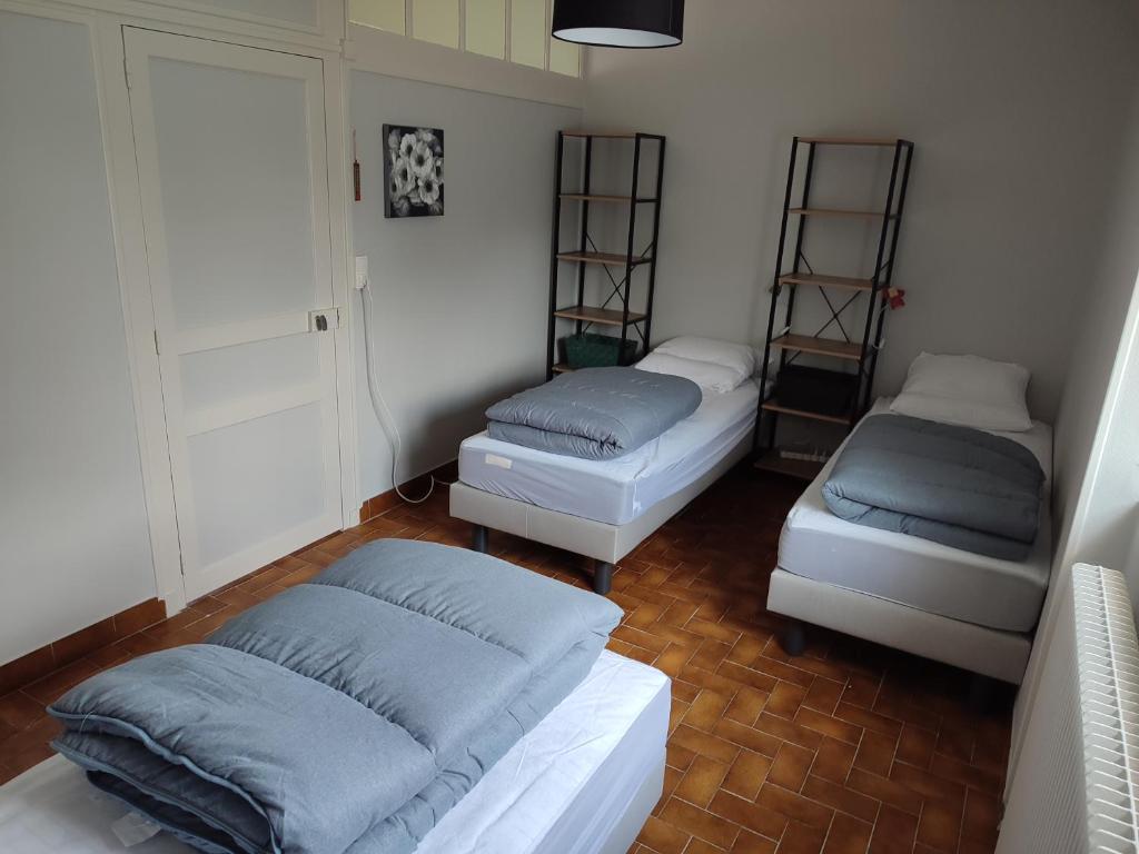 Tempat tidur dalam kamar di Gîte Chez Jeannot