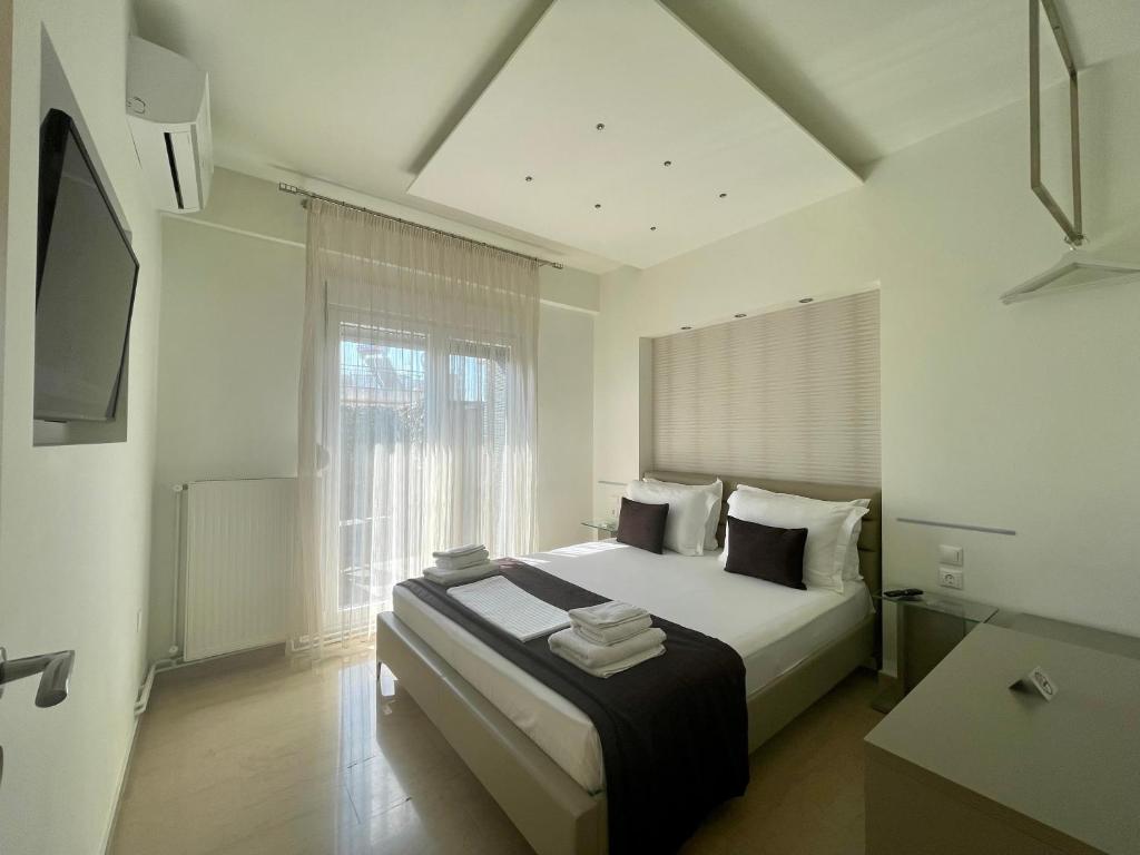 Posteľ alebo postele v izbe v ubytovaní EPaN Luxury Apartments