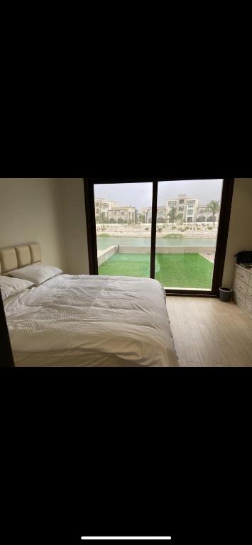 Postel nebo postele na pokoji v ubytování Hawana Salalah Villa Lake View