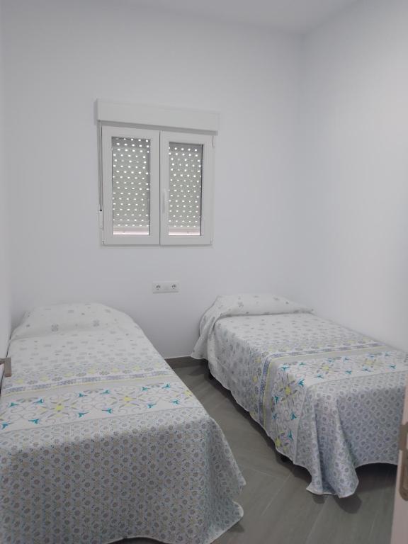 Łóżko lub łóżka w pokoju w obiekcie Apartamento relax con piscina y jacussy spa