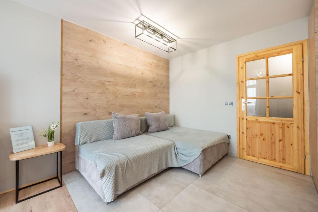 Posteľ alebo postele v izbe v ubytovaní Ochota Sunny Studio