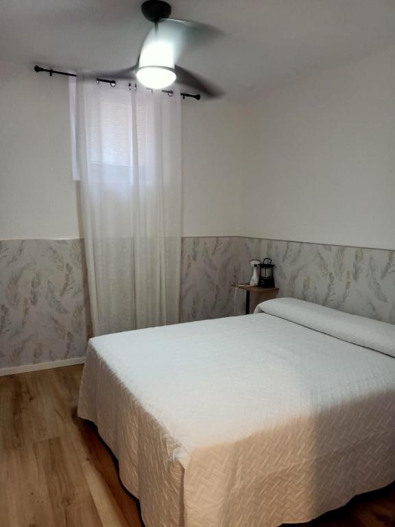 Posteľ alebo postele v izbe v ubytovaní Ángeles home