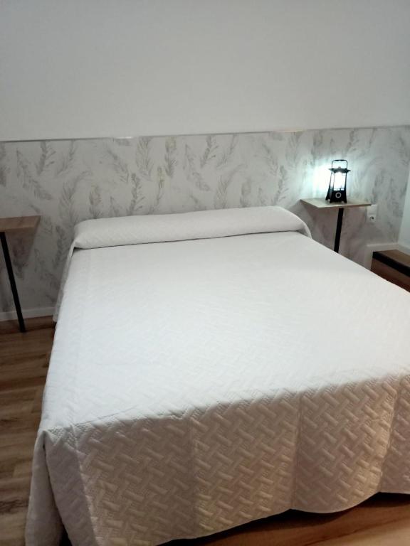 Posteľ alebo postele v izbe v ubytovaní Ángeles home
