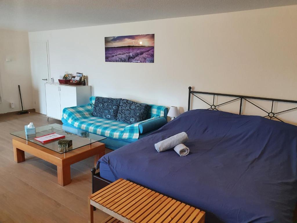 Voodi või voodid majutusasutuse Maison d'hôtes Bleu Cudrefin toas