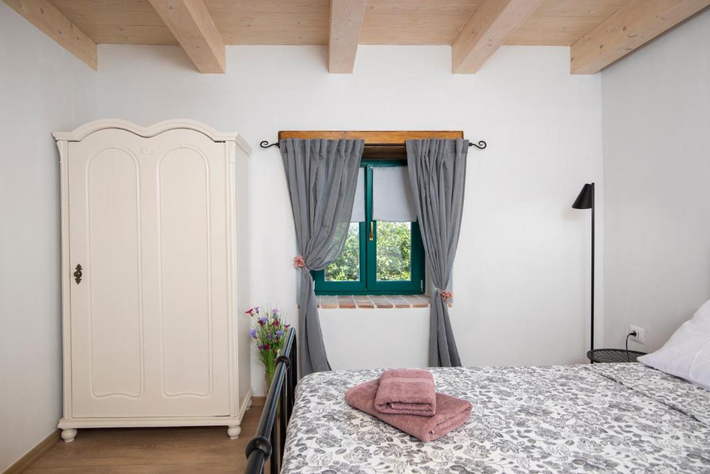 Posteľ alebo postele v izbe v ubytovaní House Eufemia