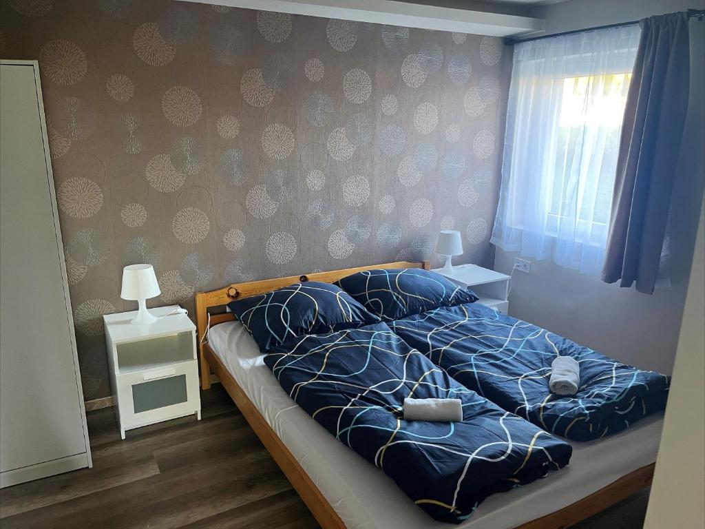 Postel nebo postele na pokoji v ubytování Zöldház Panzió